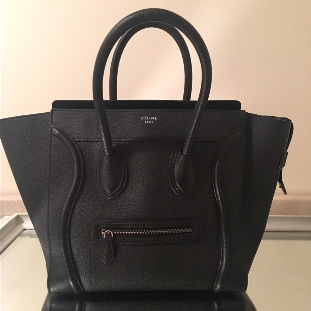 Celine micro luggage in black pebbled leather. Comes with bag insert